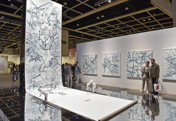 (260326) -- HONG KONG, March 26, 2026 -- Visitors view exhibits at the preview of Art Basel Hong Kong 2026 at the Hong Kong Convention and Exhibition Center in south China s Hong Kong, March 25, 2026. Art Basel Hong Kong 2026 held its preview here on Wednesday, bringing together 240 galleries from 41 countries and regions. Featuring six themed sectors and programs, the fair will open to the public from Friday to Sunday. ) CHINA-HONG KONG-ART BASEL-PREVIEW (CN) ChenxDuo 