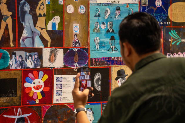 HONGKONG-ART ART-BASEL A man taking a photo of an art display at Art Basel 2026 in Hong Kong, March 26, 2026. NEXPHER Vernon Yuen HONG KONG