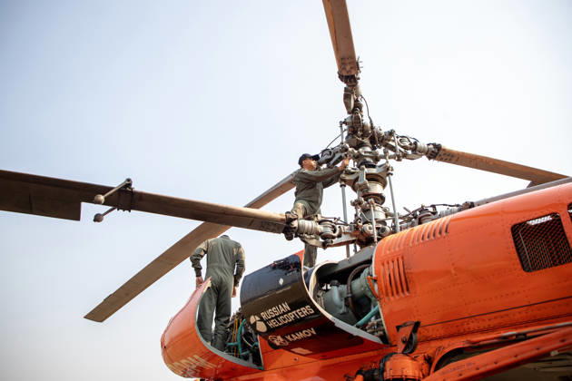 March 27, 2026, Chiang Mai, Thailand: A KA-32 helicopter from the Department of Disaster Prevention and Mitigation is prepared for aerial firefighting operations in Chiang Mai, northern Thailand, as crew members carry out checks and equipment setup while authorities respond to ongoing wildfires and rising PM2.5 air pollution. Chiang Mai Thailand - ZUMAs197 20260327_aaa_s197_318 Copyright: xPongmanatxTasirix