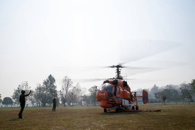 March 27, 2026, Chiang Mai, Thailand: A KA-32 helicopter from the Department of Disaster Prevention and Mitigation is prepared for aerial firefighting operations in Chiang Mai, northern Thailand, as crew members carry out checks and equipment setup while authorities respond to ongoing wildfires and rising PM2.5 air pollution. Chiang Mai Thailand - ZUMAs197 20260327_aaa_s197_322 Copyright: xPongmanatxTasirix