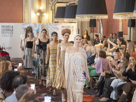 April 12, 2026, Madrid, Madrid, Spain: MADRID, SPAIN - APRIL 12: A model showcases a creation by TRADICIONES ISABELA during the Pasarela EspaoÂ±ola LimeLife at Casino Gran Via on April 12, 2026 in Madrid, Spain. Madrid Spain - ZUMAh199 20260412_zip_h199_021 Copyright: xAaronxHerediax