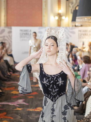 April 12, 2026, Madrid, Madrid, Spain: MADRID, SPAIN - APRIL 12: A model showcases a creation by TRADICIONES ISABELA during the Pasarela EspaoÂ±ola LimeLife at Casino Gran Via on April 12, 2026 in Madrid, Spain. Madrid Spain  - ZUMAh199 20260412_zip_h199_009 Copyright: xAaronxHerediax