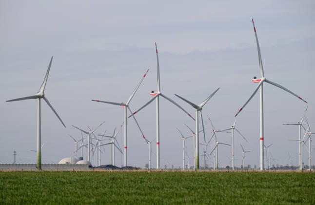 Wind energy Numerous wind turbines turning near Heide in Schleswig Holstein Heide Schleswig Holstein Germany Z9A_7976