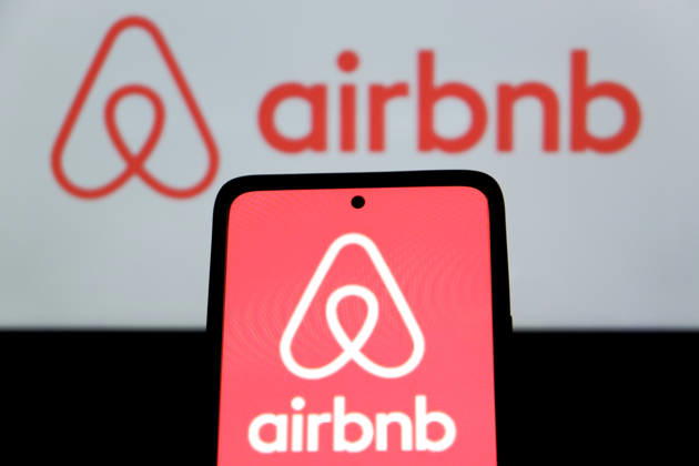 April 23, 2026, Bandung, West Java, Indonesia: In this photo illustration, Airbnb logo is displayed on a smartphone with Airbnb logo in the background Bandung Indonesia - ZUMAs281 20260423_zip_s281_006 Copyright: xAlgixFebrixSugitax