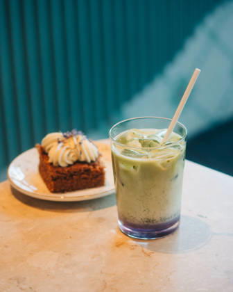 matcha latte and cake on a table in a cafe Stockholm, Stockholm County, Sweden CR_RABE260421D7-1991013-01