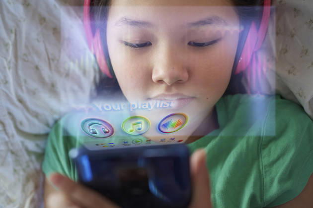 User listening to music via holographic app model released, Symbolfoto property released, AZF01257