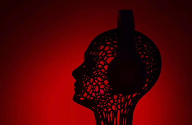 Wireframe artificial intelligence head listening to music on red, AZF01263
