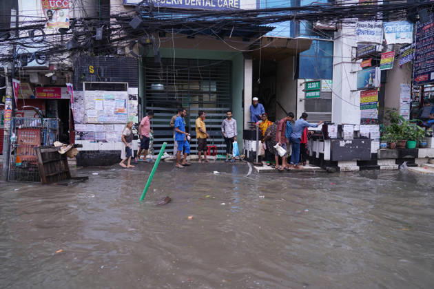 May 1, 2026, Dhaka, Dhaka, Bangladesh: DHAKA, BANGLADESH †May 1, 2026: After several hours of continuous rainfall, many small and major roads across the capital Dhaka were submerged, with water levels ranging from knee-deep to waist-deep in some areas. People forced to leave their homes for work faced severe difficulties, disrupting normal city life. Stray dogs and other animals were also left vulnerable in the flooded conditions. In many cases, clogged manholes filled with plastic waste and debris obstructed drainage systems, leading to widespread waterlogging. Dhaka Bangladesh - ZUMAk185 20260501_zip_k185_030 Copyright: xRubelxKarmakerx