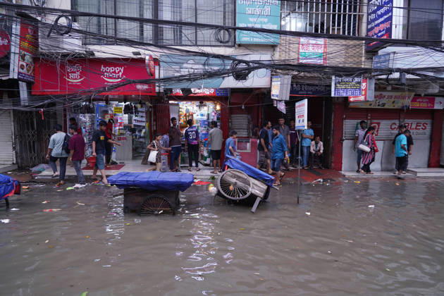 May 1, 2026, Dhaka, Dhaka, Bangladesh: DHAKA, BANGLADESH †May 1, 2026: After several hours of continuous rainfall, many small and major roads across the capital Dhaka were submerged, with water levels ranging from knee-deep to waist-deep in some areas. People forced to leave their homes for work faced severe difficulties, disrupting normal city life. Stray dogs and other animals were also left vulnerable in the flooded conditions. In many cases, clogged manholes filled with plastic waste and debris obstructed drainage systems, leading to widespread waterlogging. Dhaka Bangladesh - ZUMAk185 20260501_zip_k185_027 Copyright: xRubelxKarmakerx