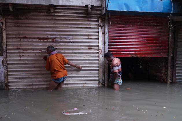 May 1, 2026, Dhaka, Dhaka, Bangladesh: DHAKA, BANGLADESH †May 1, 2026: After several hours of continuous rainfall, many small and major roads across the capital Dhaka were submerged, with water levels ranging from knee-deep to waist-deep in some areas. People forced to leave their homes for work faced severe difficulties, disrupting normal city life. Stray dogs and other animals were also left vulnerable in the flooded conditions. In many cases, clogged manholes filled with plastic waste and debris obstructed drainage systems, leading to widespread waterlogging. Dhaka Bangladesh - ZUMAk185 20260501_zip_k185_028 Copyright: xRubelxKarmakerx