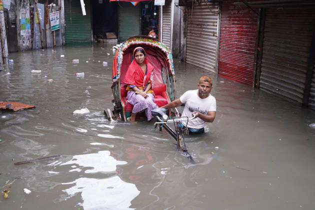 May 1, 2026, Dhaka, Dhaka, Bangladesh: DHAKA, BANGLADESH †May 1, 2026: After several hours of continuous rainfall, many small and major roads across the capital Dhaka were submerged, with water levels ranging from knee-deep to waist-deep in some areas. People forced to leave their homes for work faced severe difficulties, disrupting normal city life. Stray dogs and other animals were also left vulnerable in the flooded conditions. In many cases, clogged manholes filled with plastic waste and debris obstructed drainage systems, leading to widespread waterlogging. Dhaka Bangladesh - ZUMAk185 20260501_zip_k185_023 Copyright: xRubelxKarmakerx