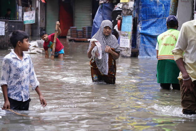 May 1, 2026, Dhaka, Dhaka, Bangladesh: DHAKA, BANGLADESH †May 1, 2026: After several hours of continuous rainfall, many small and major roads across the capital Dhaka were submerged, with water levels ranging from knee-deep to waist-deep in some areas. People forced to leave their homes for work faced severe difficulties, disrupting normal city life. Stray dogs and other animals were also left vulnerable in the flooded conditions. In many cases, clogged manholes filled with plastic waste and debris obstructed drainage systems, leading to widespread waterlogging. Dhaka Bangladesh - ZUMAk185 20260501_zip_k185_024 Copyright: xRubelxKarmakerx