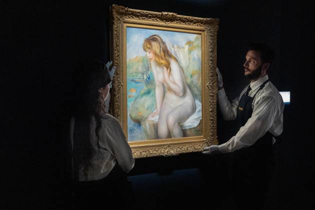 May 1, 2026, Bronx, New York, USA: Auction assistants pose with Pierre-Auguste Renoir Baigneuse assise sur un rocher during May Marquee Modern & Contemporary Auctions press preview at Sotheby s The Breuer in New York, NY on May 1, 2026. Bronx USA - ZUMAr339 20260501_znp_r339_029 Copyright: xLevxRadinx