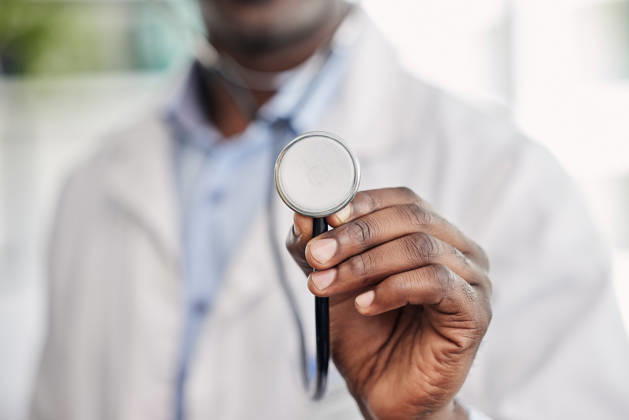 Hand, stethoscope closeup and doctor with help, healthcare service and black man in hospital. African medic, medical tools and close up for health, wellness and listening to heart, breathing and care. (License=RF) ,model released, Symbolfoto Copyright: xZoonar.com YurixArcursxpeopleimages.comx 19848593 ,model released, Symbolfoto ,property released