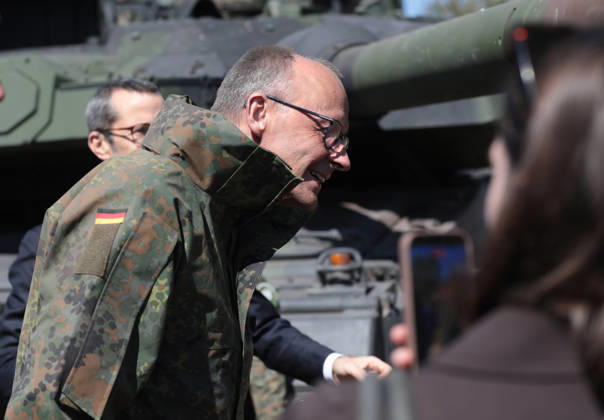 Federal Chancellor Friedrich Merz at the Bundeswehr in Munster He lowers his head in front of a Leopard 2 tank barrel Federal Chancellor Friedrich Merz at the Bundeswehr in Munster He lowers his head in front of a Leopard 2 tank barrel Munster Lower Saxony Germany