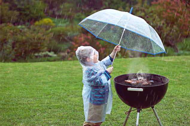 Weather, nature and boy with a grill, rain and wellness with safety, cover and winter outfit. Bbq, male child or kid with umbrella, cold or young person with food, raincoat or outdoor with protection. (License=RF) ,model released, Symbolfoto Copyright: xZoonar.com YurixArcursx 20275660 ,model released, Symbolfoto ,property released