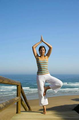 Beautiful young woman doing yoga on the beach model released Symbolfoto Copyright: xIkox Panthermedia68919750.jpg