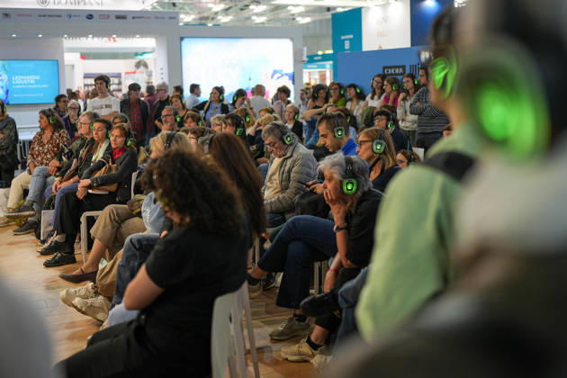 IPA84723881 - Turin. Second day of the 18th edition of the Turin International Book Fair entitled The World Saved by Kids. The fair will remain open from May 14 to 18, 2026 at Lingotto Fiere Pictured: audience listens to audiobooks  Copyright: xRiccardoxGiordanox xRiccardoxGiordanox 84723881