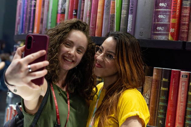 May 15, 2026, Turin, To, Italy: Some moments from the second day of the International Book Fair. Pictured are two young girls taking a selfie. Turin, May 15, 2026 Turin Italy - ZUMAa289 20260515_zia_a289_008 Copyright: xSelenexDanielex xAgfx