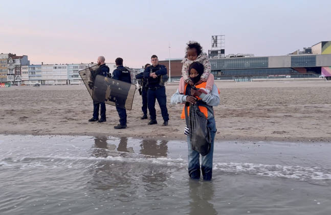 May 23, 2026, Dunkirk, Nord, France: Dunkirk, France. Police watch on as migrants wait to board an inflatable boat at the beach at Dunkirk, while attempting to cross the English Channel. More than 200,000 migrants have crossed the Channel in small boats since 2018. Dunkirk France  - ZUMAl94_ 20260523_zaf_l94_056 Copyright: xIoannisxAlexopoulosx