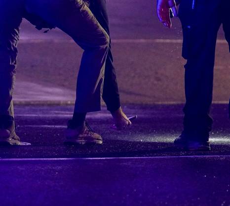 May 23, 2026, Washington, District Of Columbia, USA: Police investigators collect evidence in the 1700 block of Pennsylvania Avenue, Northwest, which is one block west of the White House in Washington, DC, USA, following the shooting there on Saturday, May 23, 2026. Two people were shot and taken to a local hospital, one has died Washington USA - ZUMAs152 20260523_faa_s152_039 Copyright: xAndrewxThomasx