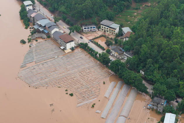 CHONGQING, CHINA - MAY 24: Rows of greenhouses are submerged after extreme rainfalls trigger flash floods and geological disasters on May 24, 2026 in Yongchuan District, Chongqing City, China. Devastating rainstorms struck parts of Southwest China s Chongqing over the weekend, resulting in multiple casualties and missing people in the municipality s Yongchuan and Beibei districts. Rescue efforts are ongoing. As of 2:30 pm on May 24, local authorities reported three deaths and 17 people missing in Yongchuan, with another two people missing in Beibei.  Copyright: xChinaxNewsxServicex 111643812950
