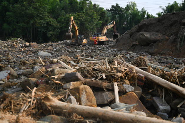 CHONGQING, CHINA - MAY 24: Rescue workers carry out search and rescue operations after extreme rainfalls trigger flash floods and geological disasters on May 24, 2026 in Yongchuan District, Chongqing City, China. Devastating rainstorms struck parts of Southwest China s Chongqing over the weekend, resulting in multiple casualties and missing people in the municipality s Yongchuan and Beibei districts. Rescue efforts are ongoing. As of 2:30 pm on May 24, local authorities reported three deaths and 17 people missing in Yongchuan, with another two people missing in Beibei.  Copyright: xChinaxNewsxServicex 111643846466