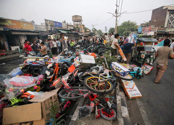 A massive pile of children™s bicycles, tricycles, and toys lies scattered on a roadside after being hastily evacuated Amritsar, May 28 (ANI): A massive pile of children™s bicycles, tricycles, and toys lies scattered on a roadside after being hastily evacuated from a nearby shop following a major fire breakout in a Rambagh market, in Amritsar on Thursday. One man died. Amritsar Punjab India Copyright: xANIx ANI_20260528516