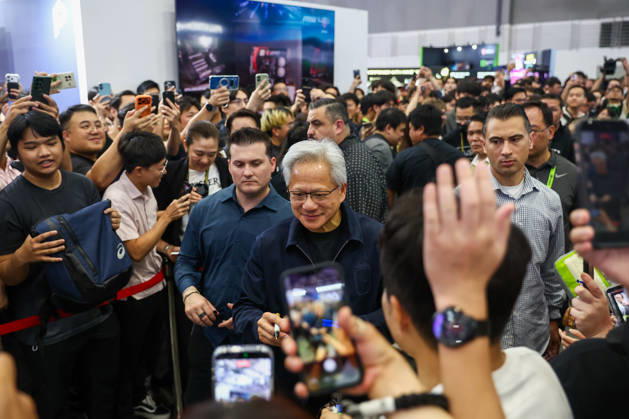 NVIDIA s CEO Jensen Huang visits COMPUTEX TAIPEI 2026 TAIPEI, TAIWAN - JUNE 3: Jensen Huang, the CEO of American multinational tech giant NVIDIA, signs autographs for fans as he is surrounded by heaps of supporters and staff during his visit to the COMPUTEX TAIPEI trade show, in Taipei, Taiwan, on June 3, 2026. COMPUTEX TAIPEI is one of the world’s largest and most significant trade shows, featuring latest technologies, drones, data centres, Artificial Intelligence (AI) technologies, supercomputers, semiconductors products and other things from major international firms such as Nvidia, Intel, NXP and Foxconn. Daniel Ceng Anadolu Taipei Taiwan. Editorial use only. Please get in touch for any other usage. Copyright: x2026xAnadoluxDanielxCengx