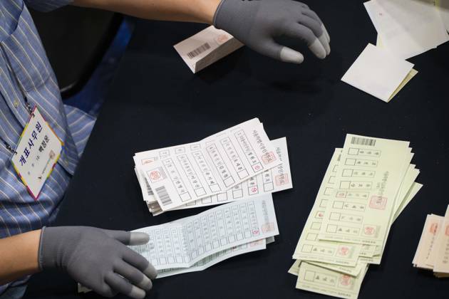 June 3, 2026, Seoul, South Korea: Ballots are sprawled across a tabletop as poll workers count them after the conclusion of voting in South KoreaÃ¢â‚¬â ¢s local elections on Wednesday, June 3, 2026 in Seoul, South Korea. Seoul South Korea  - ZUMAh163 20260603_znp_h163_027 Copyright: xJintakxHanx