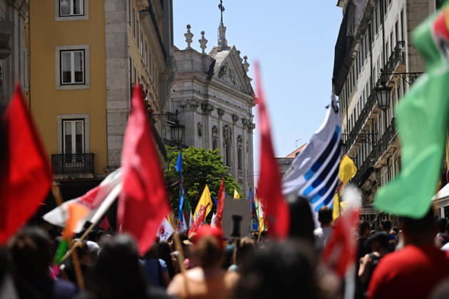 Nationwide Strike For Workers Lisbon LISBON, PORTUGAL - JUNE 03: Protesters hold a banner and wave red trade union flags as they line the streets during a national mobilization in Lisbon, Portugal on June 03, 2026. The demonstration, organized under the National Fight Day motto, demands increased wages, guaranteed labor rights, and measures against the rising cost of living, while advocating for the right to health and housing. Zed Jameson Anadolu Lisbon Portugal. Editorial use only. Please get in touch for any other usage.  Copyright: x2026xAnadoluxZedxJamesonx