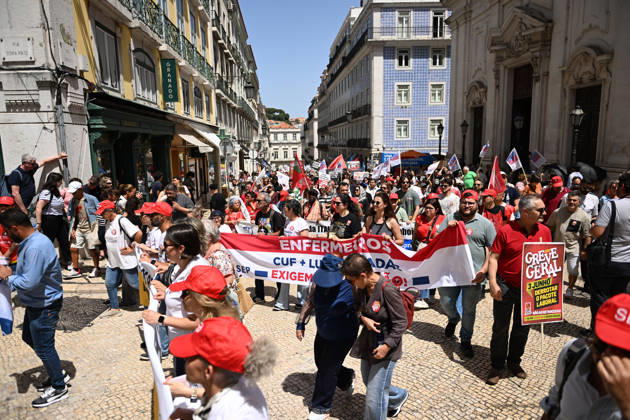 Nationwide Strike For Workers Lisbon LISBON, PORTUGAL - JUNE 03: Protesters hold a banner and wave red trade union flags as they line the streets during a national mobilization in Lisbon, Portugal on June 03, 2026. The demonstration, organized under the National Fight Day motto, demands increased wages, guaranteed labor rights, and measures against the rising cost of living, while advocating for the right to health and housing. Zed Jameson Anadolu Lisbon Portugal. Editorial use only. Please get in touch for any other usage.  Copyright: x2026xAnadoluxZedxJamesonx