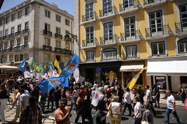 Nationwide Strike For Workers Lisbon LISBON, PORTUGAL - JUNE 03: Protesters hold a banner and wave red trade union flags as they line the streets during a national mobilization in Lisbon, Portugal on June 03, 2026. The demonstration, organized under the National Fight Day motto, demands increased wages, guaranteed labor rights, and measures against the rising cost of living, while advocating for the right to health and housing. Zed Jameson Anadolu Lisbon Portugal. Editorial use only. Please get in touch for any other usage.  Copyright: x2026xAnadoluxZedxJamesonx