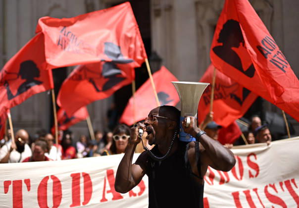 Nationwide Strike For Workers Lisbon LISBON, PORTUGAL - JUNE 03: Protesters hold a banner and wave red trade union flags as they line the streets during a national mobilization in Lisbon, Portugal on June 03, 2026. The demonstration, organized under the National Fight Day motto, demands increased wages, guaranteed labor rights, and measures against the rising cost of living, while advocating for the right to health and housing. Zed Jameson Anadolu Lisbon Portugal. Editorial use only. Please get in touch for any other usage.  Copyright: x2026xAnadoluxZedxJamesonx