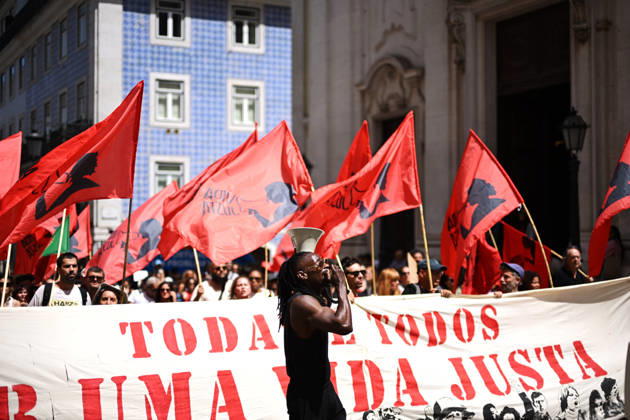 Nationwide Strike For Workers Lisbon LISBON, PORTUGAL - JUNE 03: Protesters hold a banner and wave red trade union flags as they line the streets during a national mobilization in Lisbon, Portugal on June 03, 2026. The demonstration, organized under the National Fight Day motto, demands increased wages, guaranteed labor rights, and measures against the rising cost of living, while advocating for the right to health and housing. Zed Jameson Anadolu Lisbon Portugal. Editorial use only. Please get in touch for any other usage.  Copyright: x2026xAnadoluxZedxJamesonx