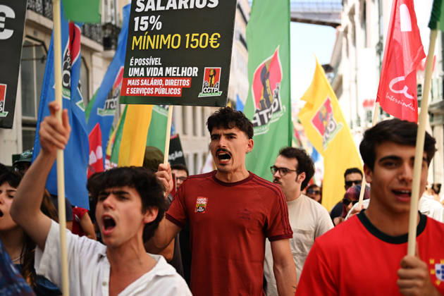 Nationwide Strike For Workers Lisbon LISBON, PORTUGAL - JUNE 03: Protesters hold a banner and wave red trade union flags as they line the streets during a national mobilization in Lisbon, Portugal on June 03, 2026. The demonstration, organized under the National Fight Day motto, demands increased wages, guaranteed labor rights, and measures against the rising cost of living, while advocating for the right to health and housing. Zed Jameson Anadolu Lisbon Portugal. Editorial use only. Please get in touch for any other usage.  Copyright: x2026xAnadoluxZedxJamesonx