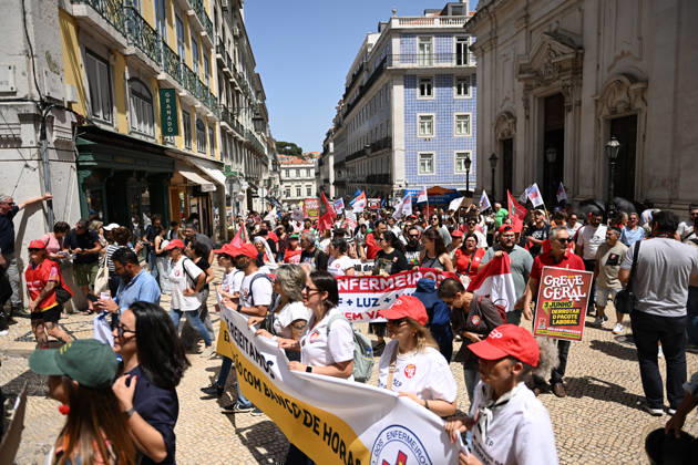 Nationwide Strike For Workers Lisbon LISBON, PORTUGAL - JUNE 03: Protesters hold a banner and wave red trade union flags as they line the streets during a national mobilization in Lisbon, Portugal on June 03, 2026. The demonstration, organized under the National Fight Day motto, demands increased wages, guaranteed labor rights, and measures against the rising cost of living, while advocating for the right to health and housing. Zed Jameson Anadolu Lisbon Portugal. Editorial use only. Please get in touch for any other usage.  Copyright: x2026xAnadoluxZedxJamesonx
