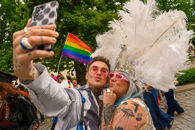 June 6, 2026, Vilnius, Lithuania: A couple poses for selfies during the pride parade. Vilnius on June 6 marked Lithuanian Pride 2026 with a march for equality, drawing thousands to the city center in a public show of visibility, solidarity, and support for LGBTQ+ rights. Vilnius Lithuania - ZUMAs197 20260606_aaa_s197_184 Copyright: xYauhenxYerchakx