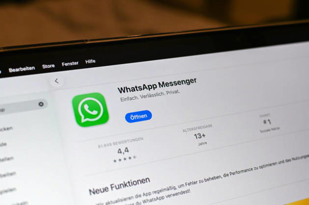 The logo of the messenger service WhatsApp on the display of a Macbook laptop WhatsApp is one of the worlds most widely used communication services for messages, voice and video calls Bad Wörishofen Bavaria Germany Copyright: xPhilippxMerkx
