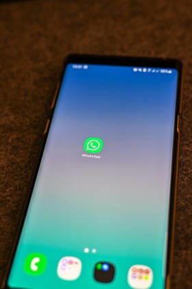 The logo of the messenger service WhatsApp on the display of a smartphone WhatsApp is one of the worlds most widely used communication services for messages, voice and video calls Bad Wörishofen Bavaria Germany Copyright: xPhilippxMerkx