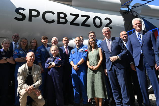 From left: American astronaut Andrew Feustel (crouching), SPD Minister of Defense Jaromir Zuna (in the background), next to him on the right, Prime Minister Andrej Babis (ANO), future Czech astronaut and pilot Ales Svoboda, Minister of Industry and Trade Karel Havlicek (ANO) and U.S. Ambassador to the Czech Republic Nicholas Merrick pose with participants of the Zero-G mission in front of the SpaceBuzz mobile rocket, which offers visitors a virtual journey into space and a view of Earth through the eyes of astronauts, within an an event for the Czech Journey to Space project, featuring an educational program and a virtual space mission, at Prague Exhibition Grounds, Prague Czech Republic, on June 8, 2026. (CTKxPhoto KaterinaxSulova) CTKP CTKPhotoP2026060805686