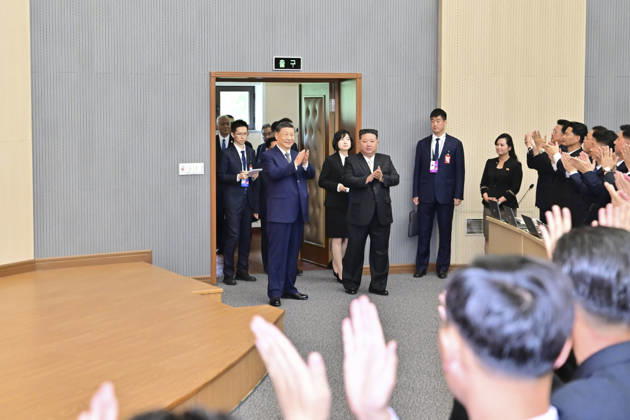 (260609) -- PYONGYANG, June 9, 2026 -- Xi Jinping, general secretary of the Communist Party of China Central Committee and Chinese president, walks into a lecture hall of the Central Cadres Training School of the Workers Party of Korea (WPK) in the company of Kim Jong Un, general secretary of the WPK and president of the State Affairs of the Democratic People s Republic of Korea (DPRK), in Pyongyang, the DPRK, June 9, 2026. On Tuesday morning, Xi, accompanied by Kim, visited the Central Cadres Training School of the WPK in Pyongyang. ) DPRK-PYONGYANG-CHINA-XI JINPING-WPK-CENTRAL CADRES TRAINING SCHOOL ZhaixJianlan 