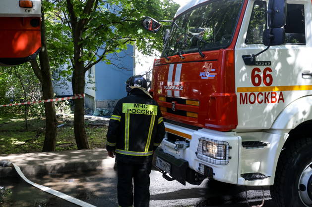 RUSSIA, MOSCOW - JUNE 10, 2026: An emergency worker responds to a fire at an apartment building on Aviatorov Street, Solntsevo, western Moscow, with six balconies reportedly destroyed and 30 residents bringing themselves to safety. Pavel Seleznev TASS  93624580