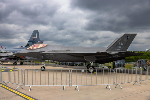 Trade visitor day at ILA Berlin 2026, Berlin, 12 06 2026 A Lockheed Martin F 35A Lightning II of the U S Air Force 48th Operations Group, identification AF 19 5485, code number LN can be seen on an outdoor area as a static exhibit In the background, the tail unit of another military aircraft with the inscription Texas ANG can be se 20260612-286A9751-M4000