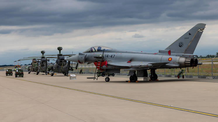 Trade visitor day at ILA Berlin 2026, Berlin, 12 06 2026 A Eurofighter Typhoon of the Spanish Air Force registration number 14 47, C 16 47 stands on the apron, behind it a Tiger combat helicopter Both aircraft are parked under a cloudy sky on the exhibition grounds of the ILA Berlin Schöneberg Berlin ExpoCenter Airport Brandenburg Germany 20260612-286A9983-M4000