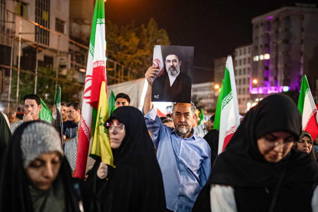 Iranians rally , waving flags in support of the government s negotiations to end the war with the United States, Anti?U.S. and anti?Israel chants echoed at Enghelab Square in Tehran late Friday, June 12, 2026.  IRN2026061205 BehnamxTofighi