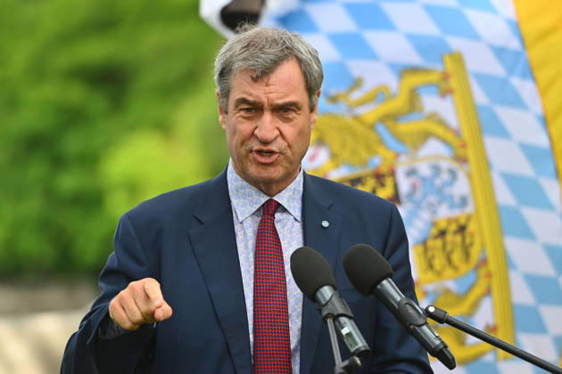 Markus SOEDER Ministerpraesident Bavaria and CSU chairman in front of Bavarian flag,flag single picture,cropped single motif,portrait,portrait,portrait gesture, inauguration of the new Ludwig II monument on the bastion of the Corneliusbruecke on 13 06 2026 in Munich