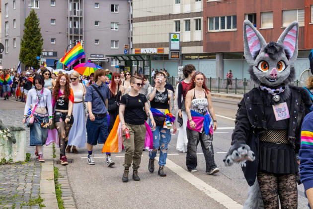 Augsburg, Bavaria, Germany June 13, 2026: Participants carrying rainbow flags and wearing colorful costumes take part in Christopher Street Day (CSD) in Augsburg. The parade through the city center promotes the rights of LGBTQ+ people as well as social diversity and tolerance