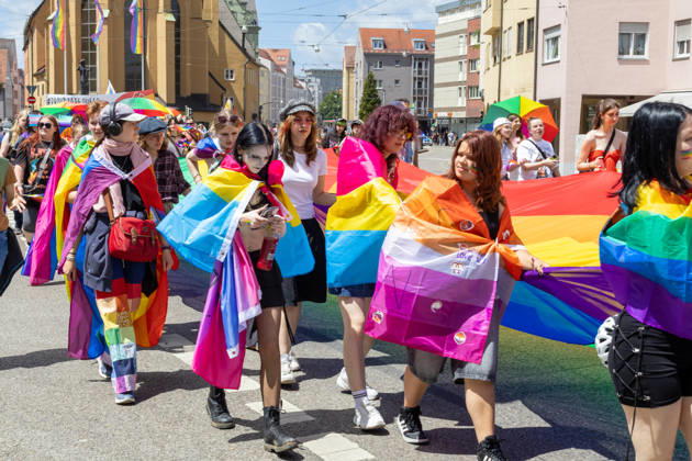 Augsburg, Bavaria, Germany June 13, 2026: Participants carrying rainbow flags and wearing colorful costumes take part in Christopher Street Day (CSD) in Augsburg. The parade through the city center promotes the rights of LGBTQ+ people as well as social diversity and tolerance