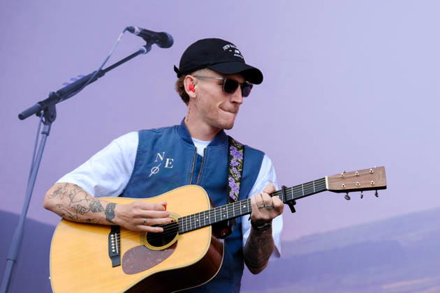 June 20, 2026, Newport, United Kingdom: Scottish singer songwriter Nathan Evans born Nathan Alexander Evans, performing live on stage with The Saint PHNX Band at the Isle of Wight festival. He first gained fame in 2020 by posting videos of himself singing sea shanties on TikTok. In 2021, he released a version of the folk song Wellerman which peaked at the top of the UK Singles Chart. The Saint PHNX Band is currently Nathan Evans Lead vocals and acoustic guitar., Stevie Jukes Lead vocals, guitar, and bass, Alan Jukes Backing vocals, drums, and percussion Newport United Kingdom - ZUMAs197 20260620_aaa_s197_155 Copyright: xDawnxFletcher-Parkx